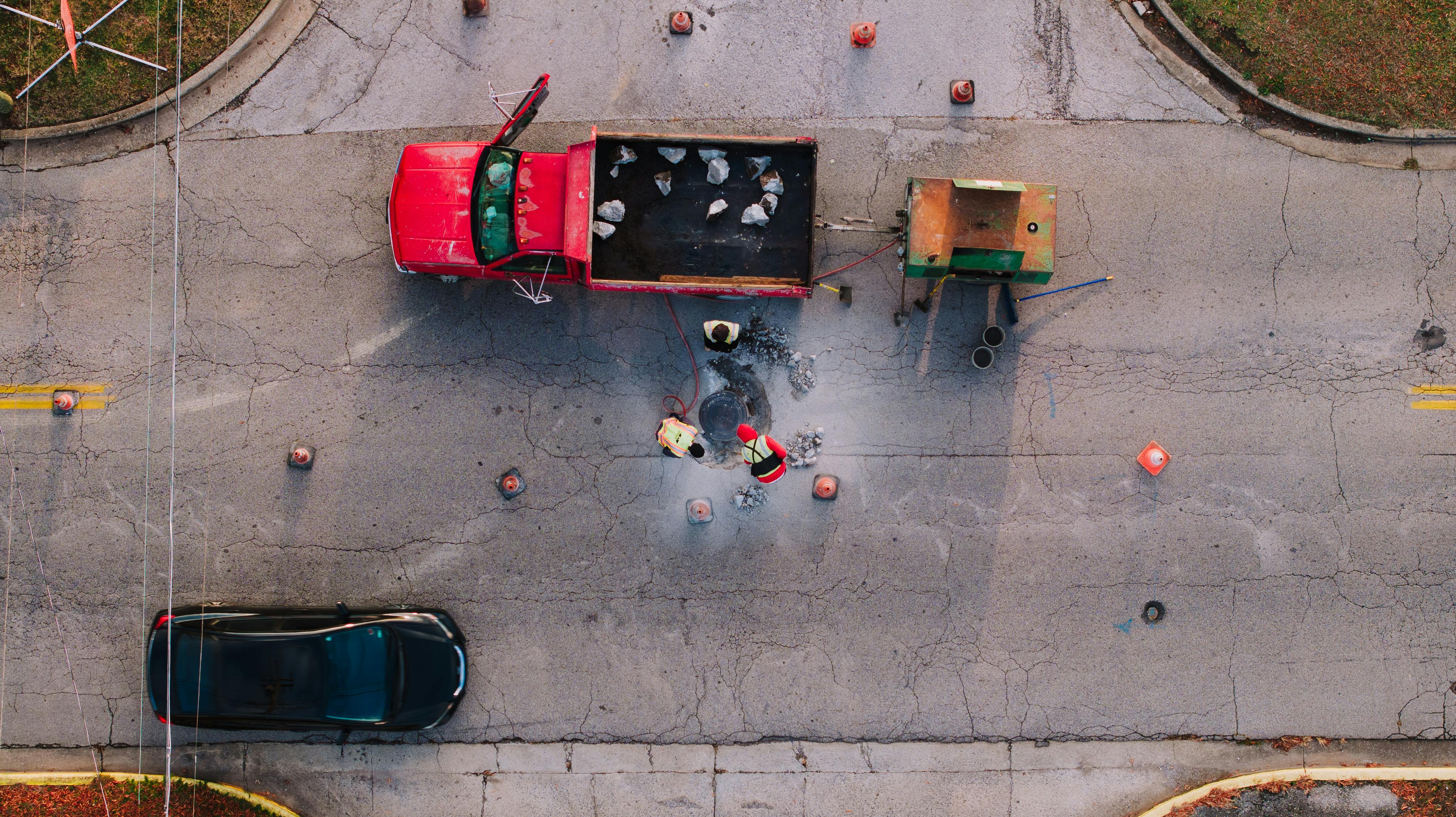 Repaired asphalt surface showing professionally sealed cracks