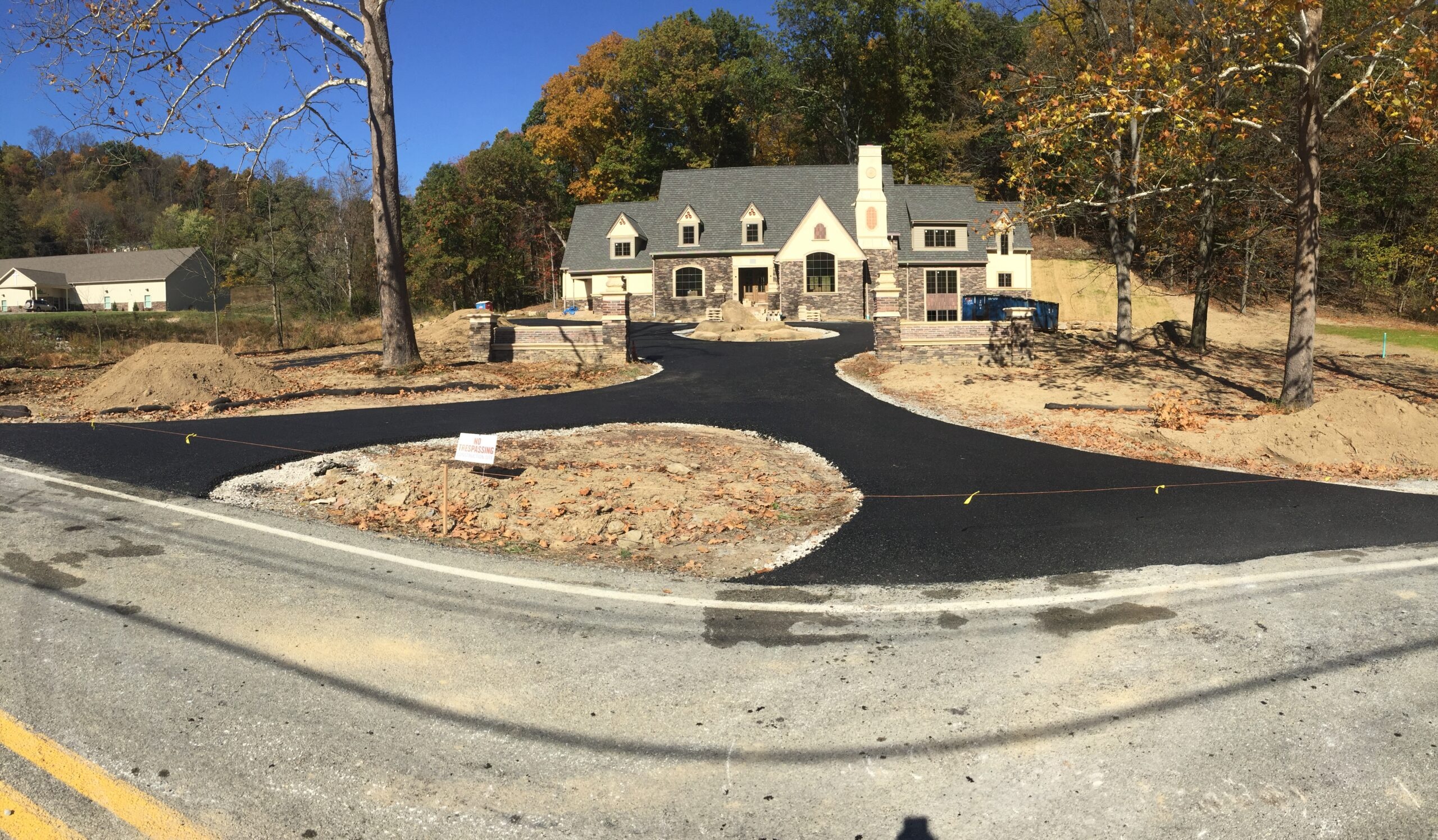 Driveway paving in progress at residential home