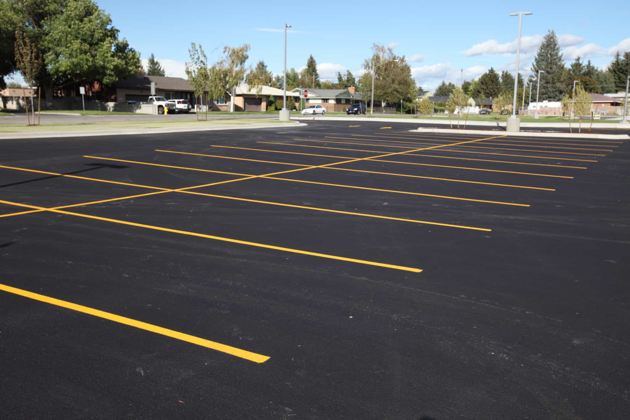 Completed sealcoated surface with rich dark protective finish